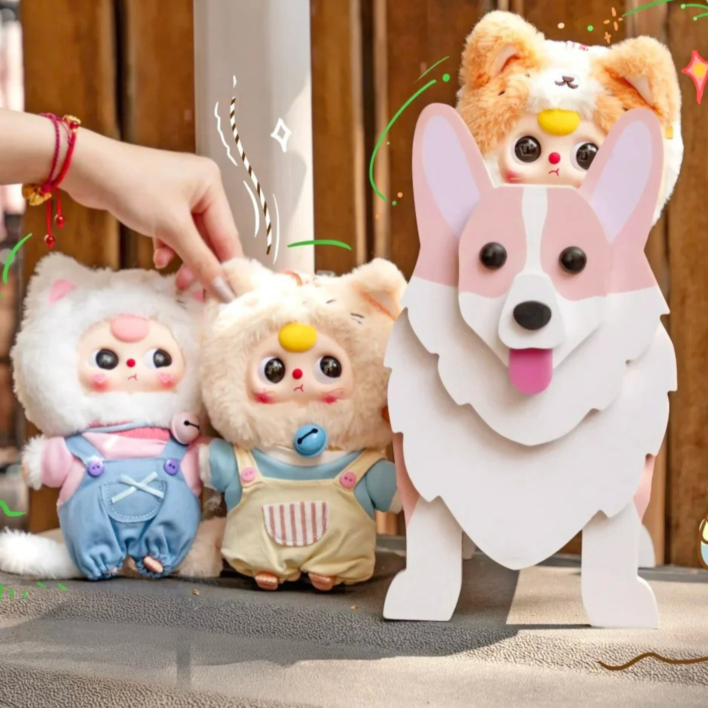 Three plush animal keychains with stitched faces in denim and light tan outfits; metal rings