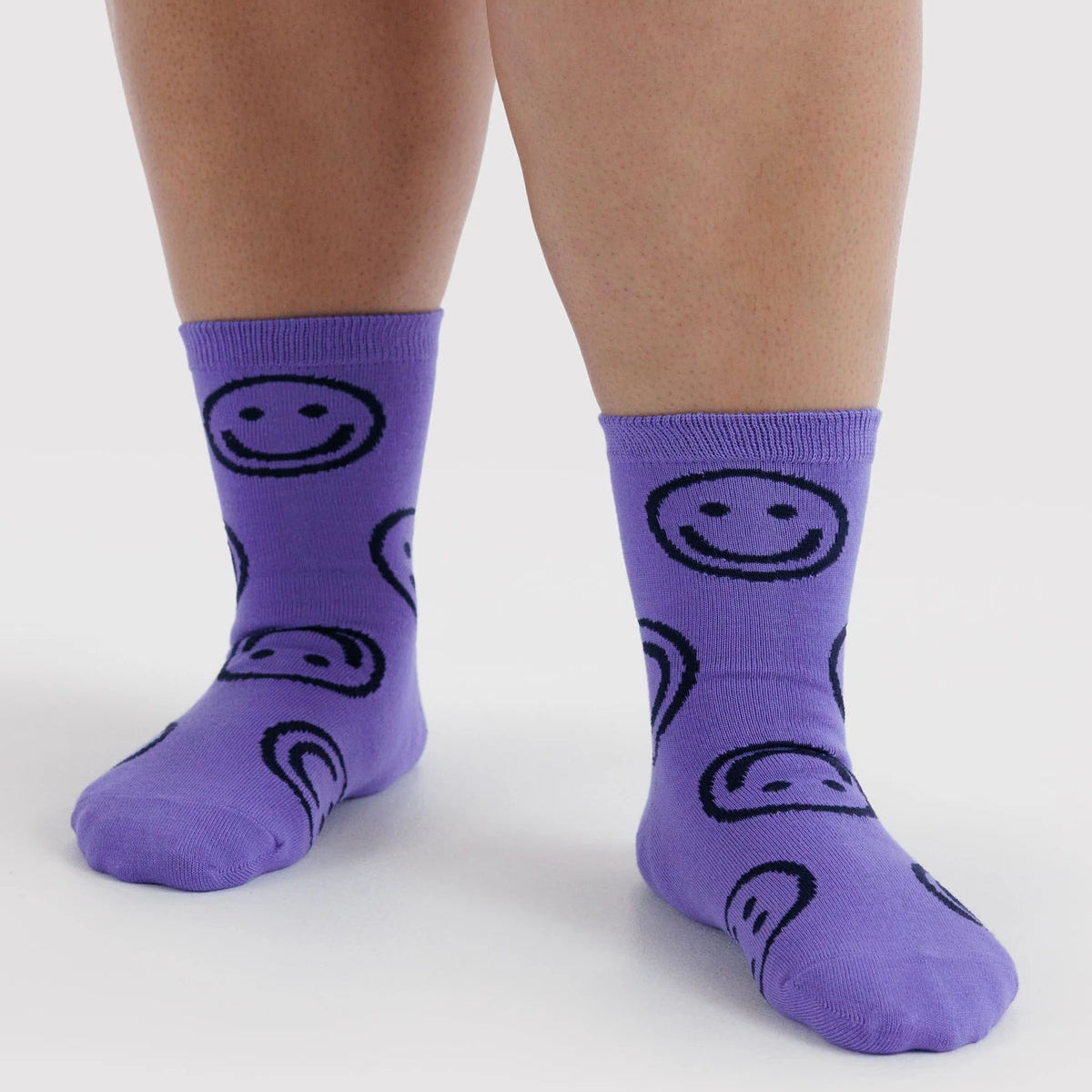 Baggu lavender crew socks with smiling face prints, ribbed crew cuff.