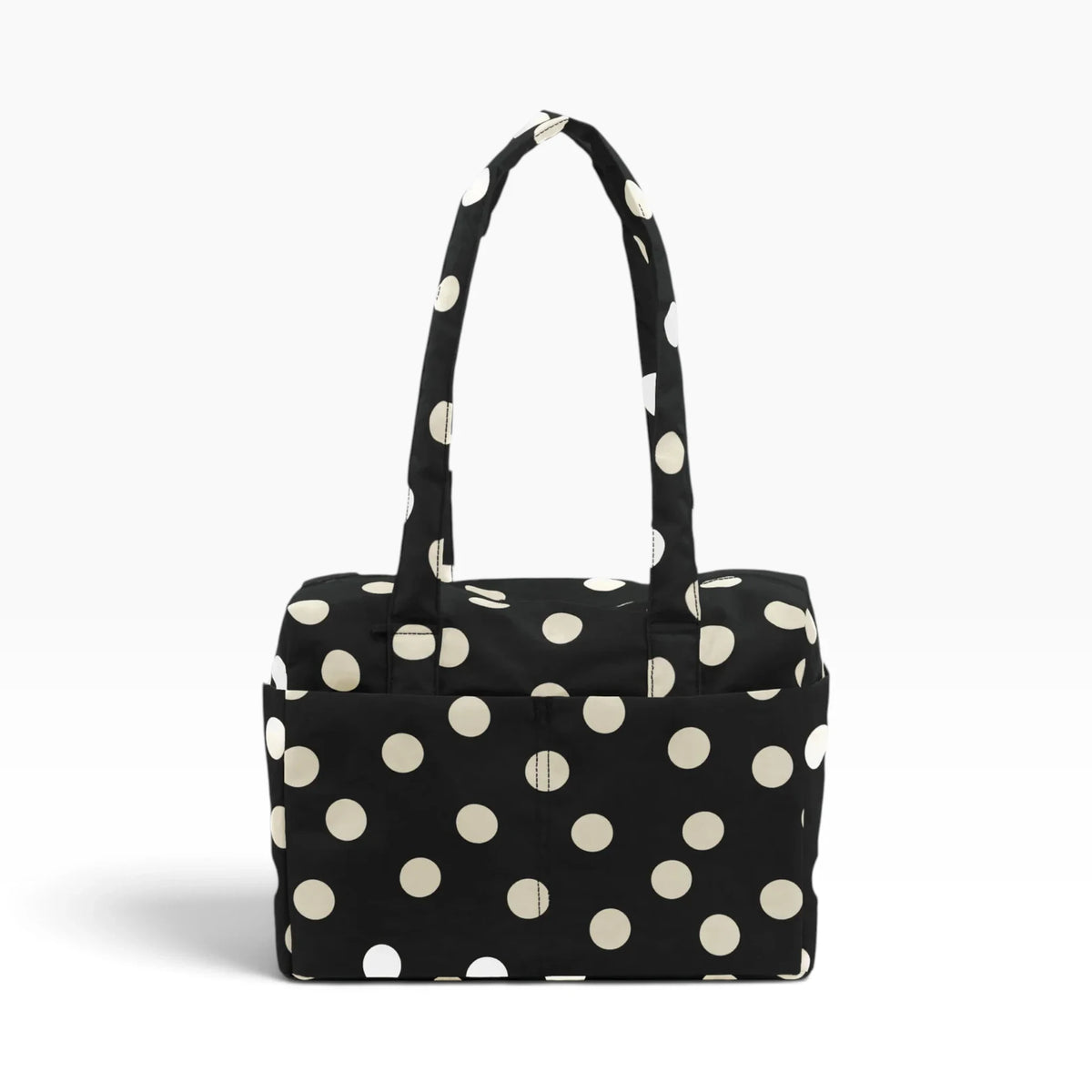 Black tote bag with cream polka dots and top handle, open-top pouch style