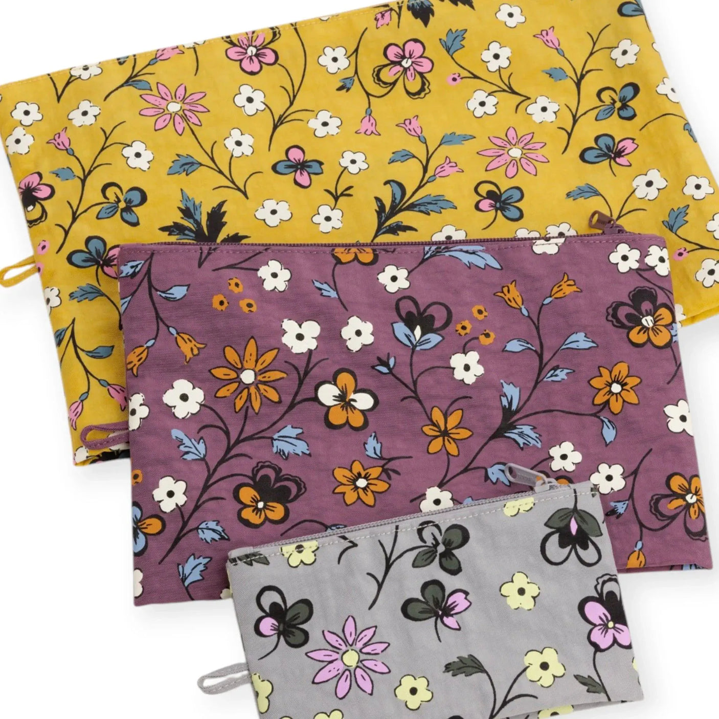 Floral zip pouch set of 3 overlapping: mustard yellow, plum purple, and white