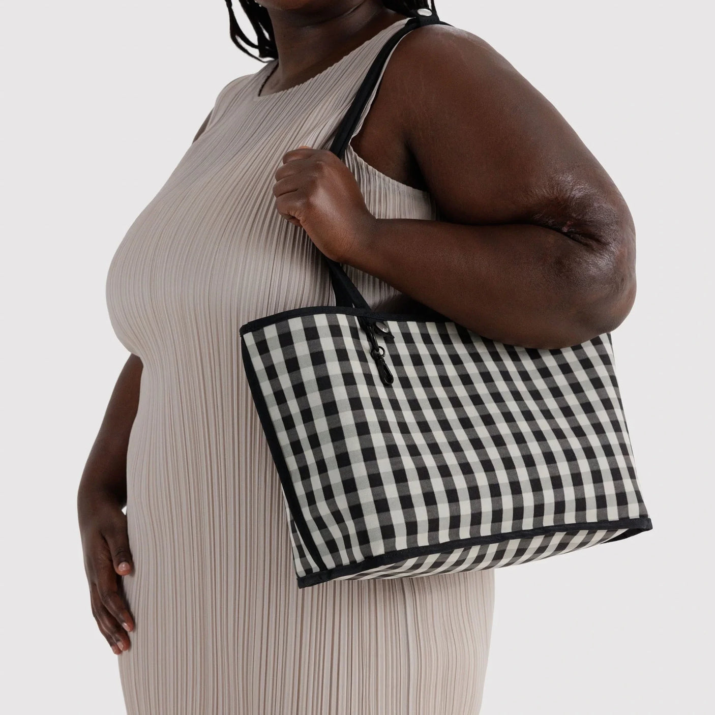 Black-and-white checkered nylon medium tote with top handles and zip closure