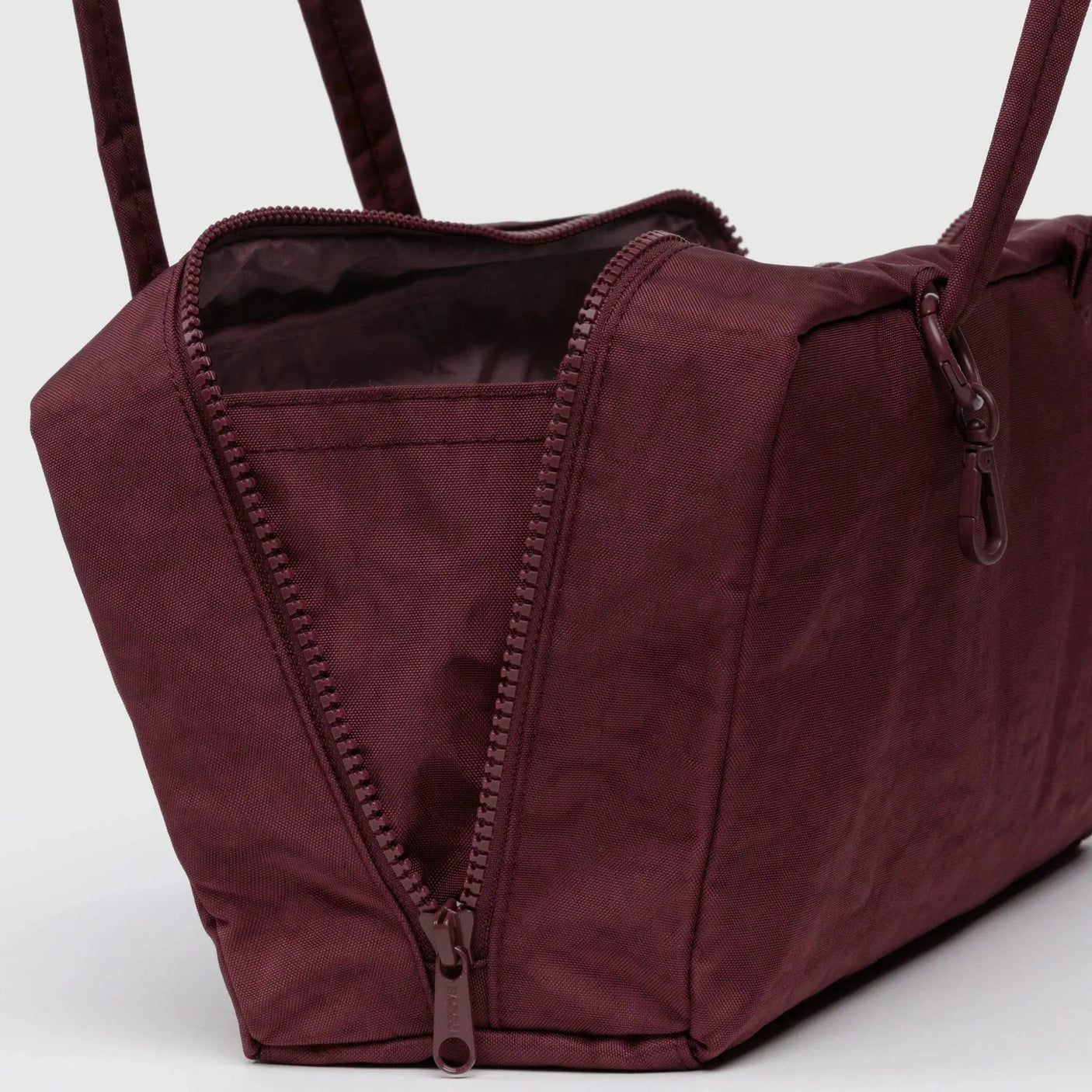 Mahogany nylon bowler bag close-up showing open top, lining, and zipper