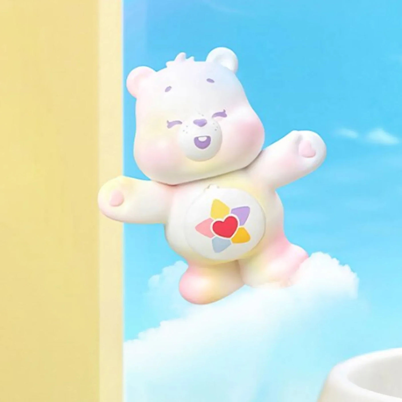 White bear mini figure with pastel heart belly emblem, arms outstretched.