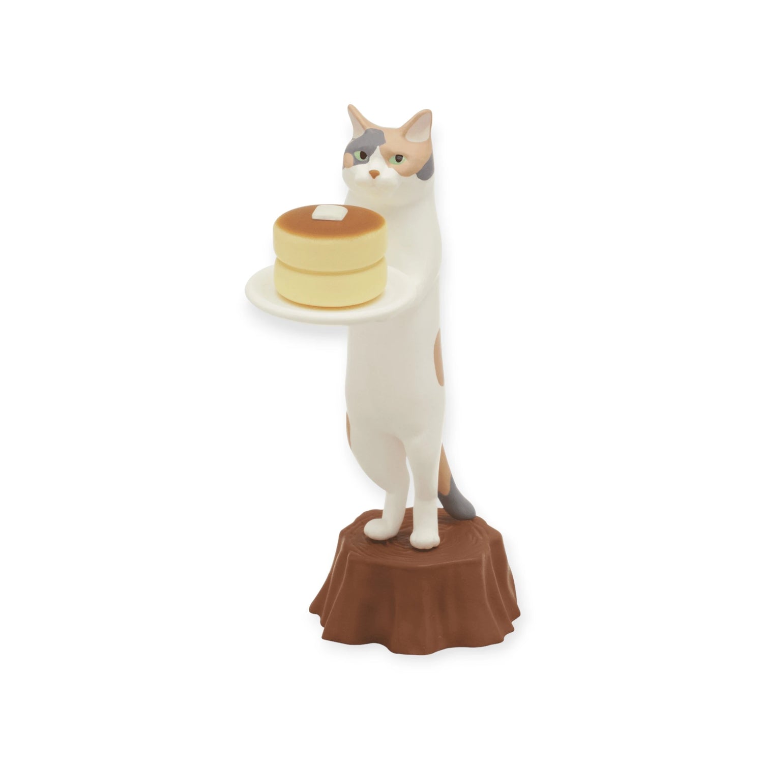 The Kitan Club Cat Cafe Waiter Blind Box features a standing cat figurine holding a plate with pancakes and butter, set on a tree stump-like brown base.
