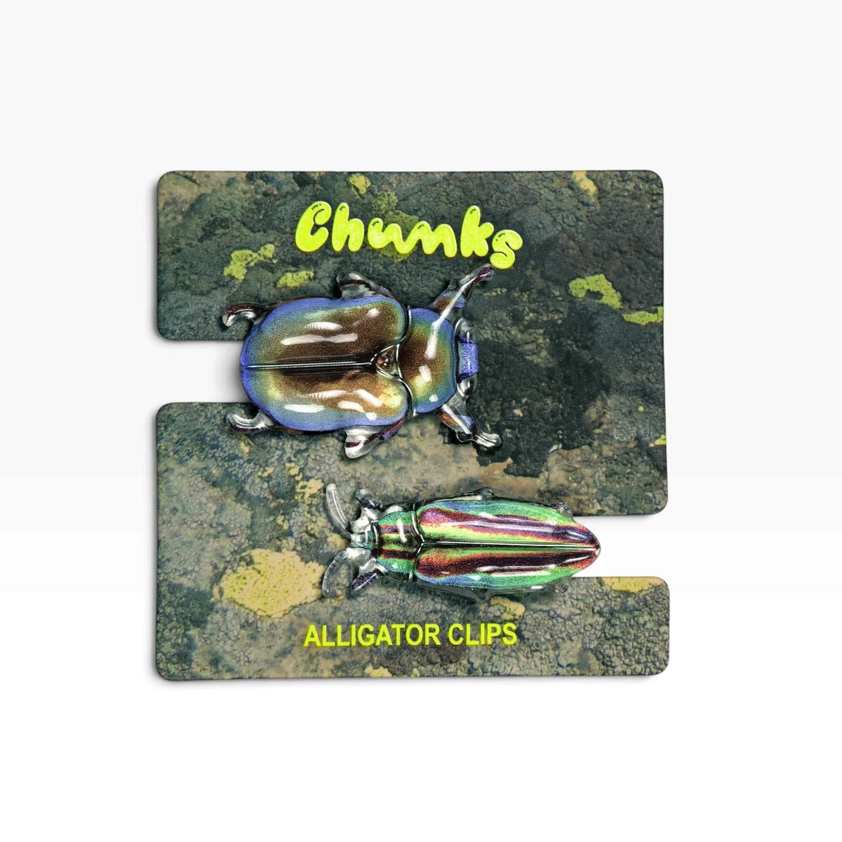 Iridescent beetle hair clips on a branded display card
