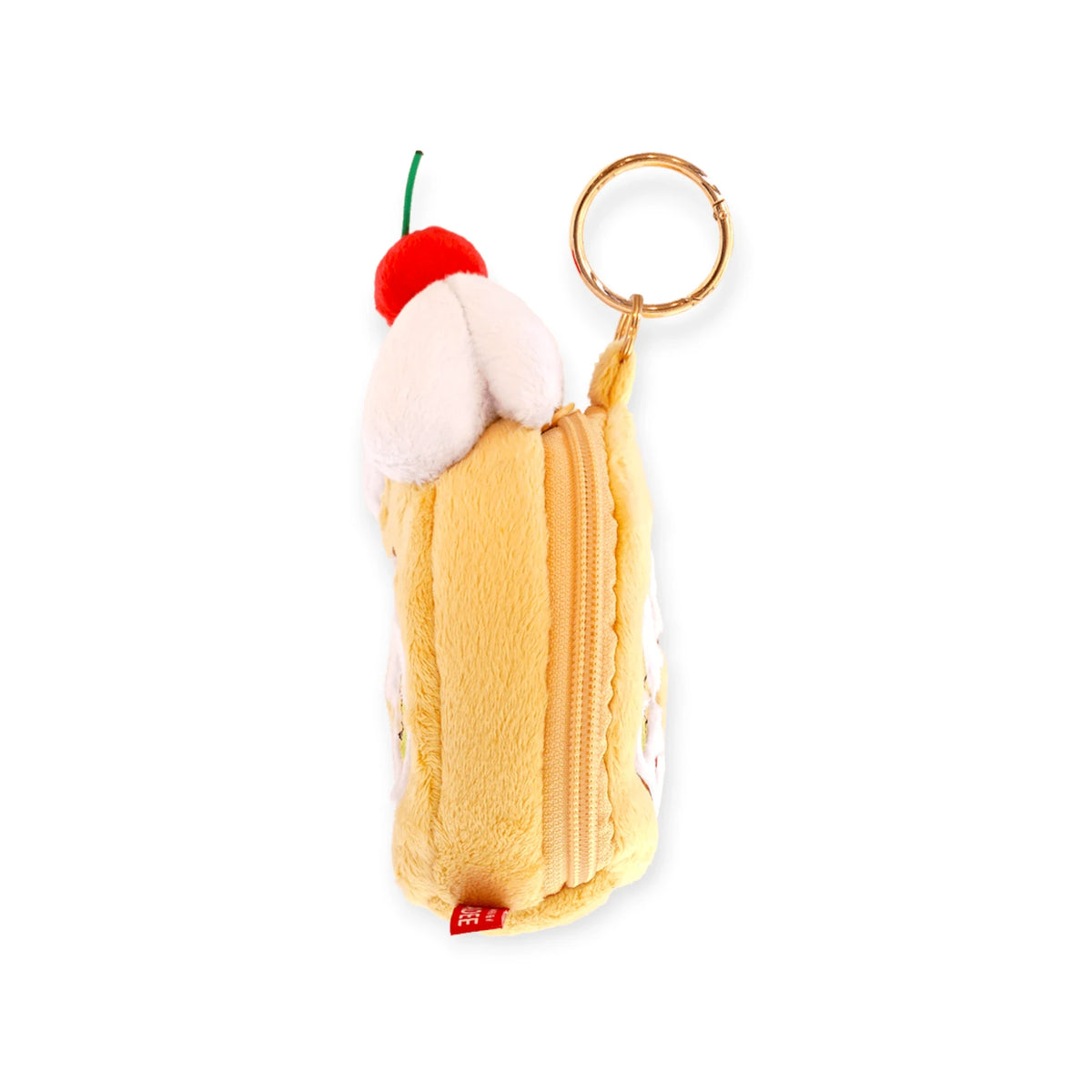 Tall yellow plush zip pouch with white frosting top, red cherry, and gold keyring