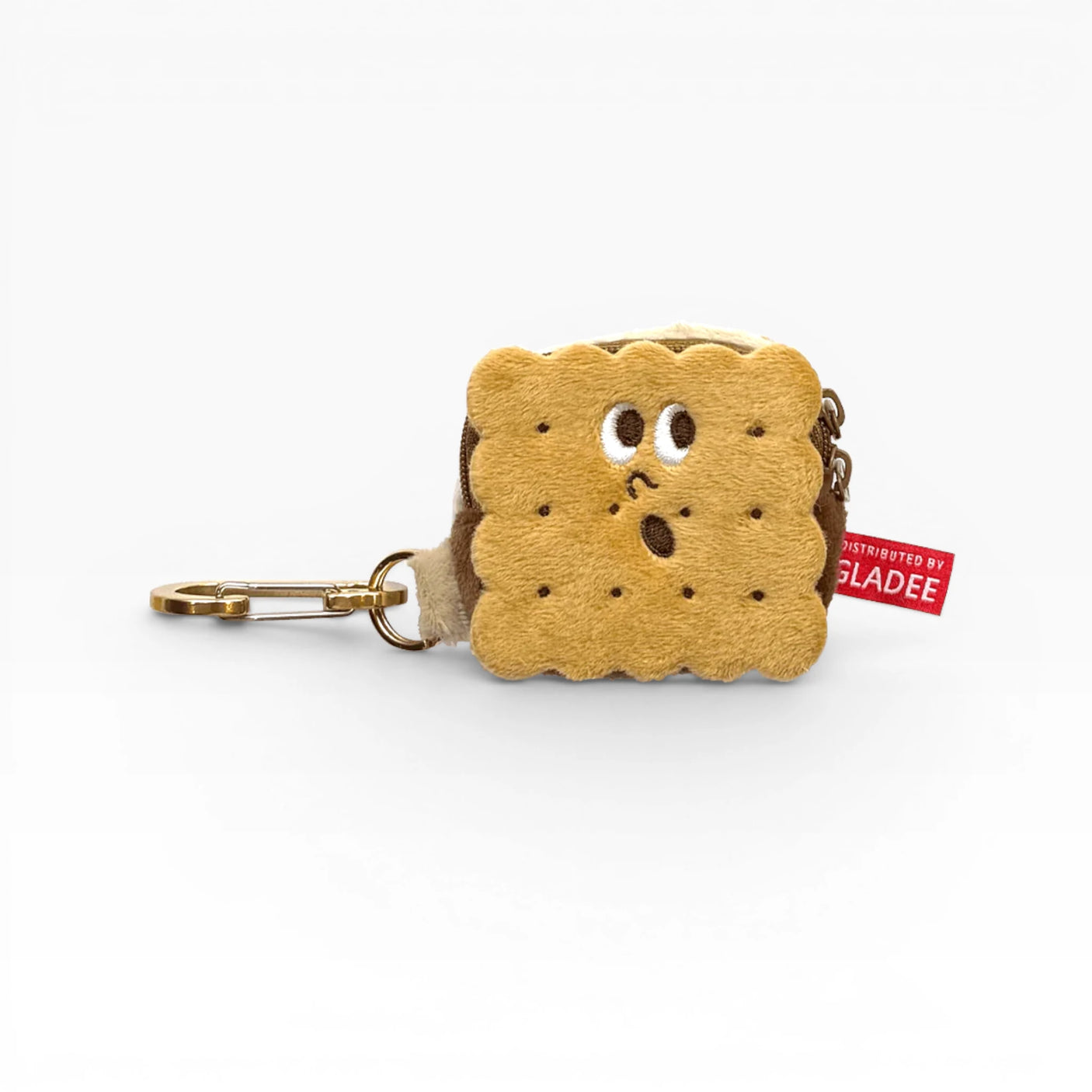 Plush cookie-shaped AirPods case with cookie face, zipper, and metal carabiner clip