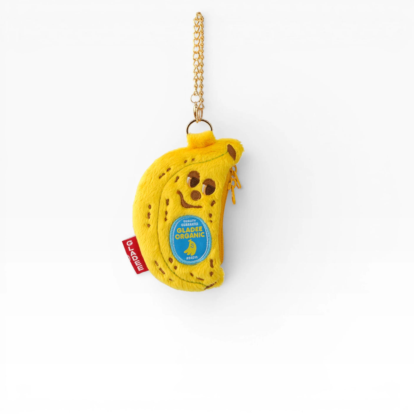 Banana plush AirPods case with gold chain and blue logo patch