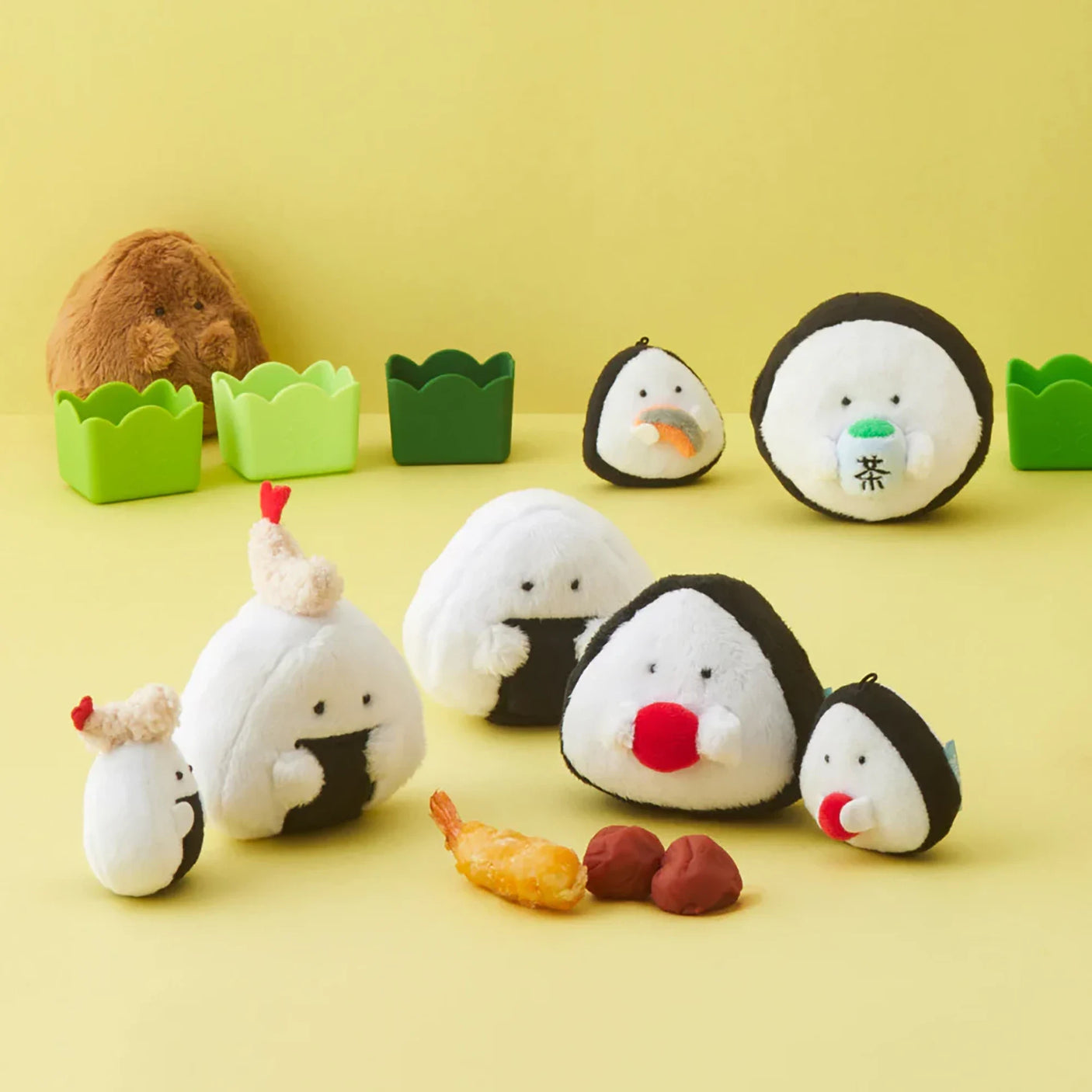 Assorted plush rice ball keychains with bead chains, white bodies with black centers