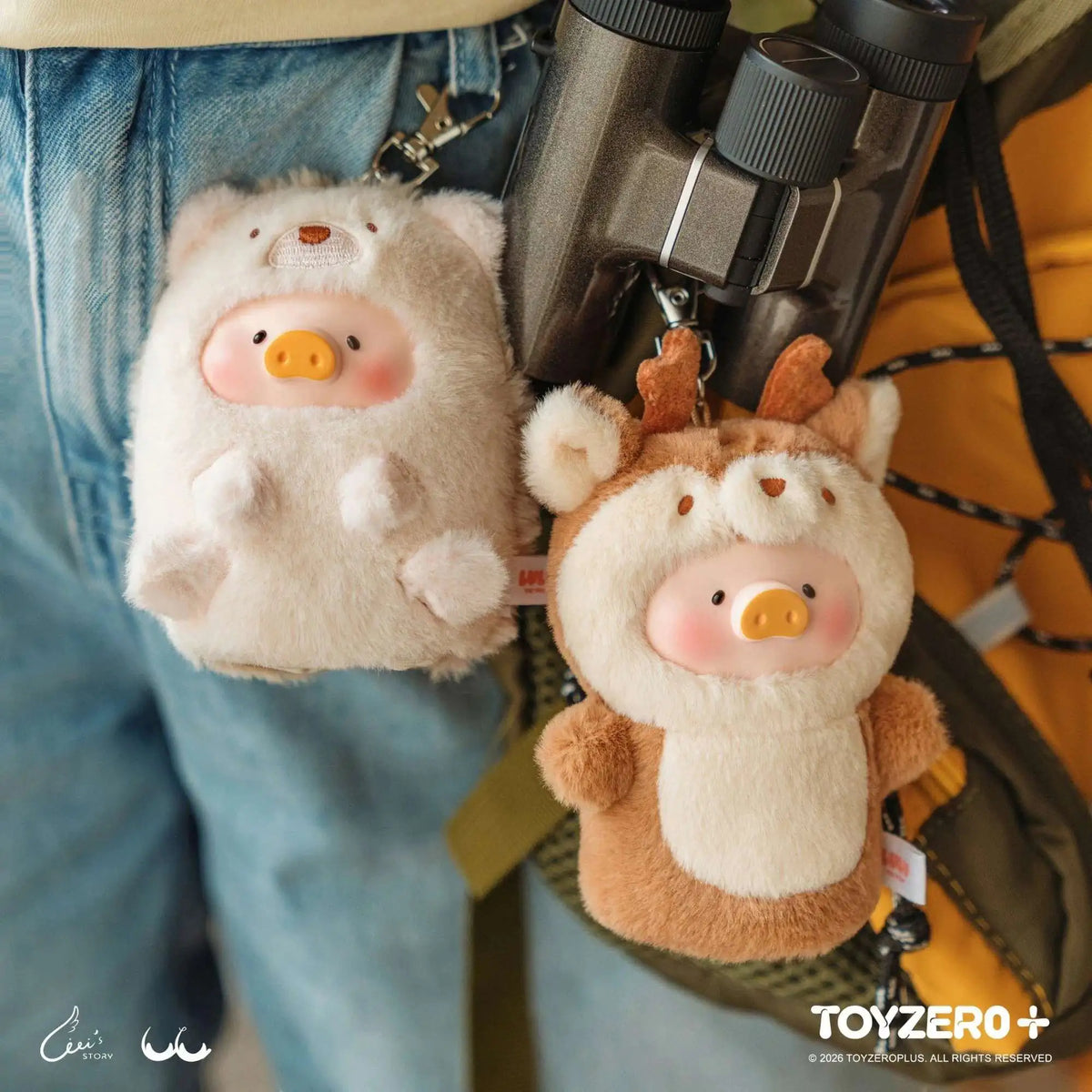Hedgehog and lion pig plush keychains hanging from a backpack strap