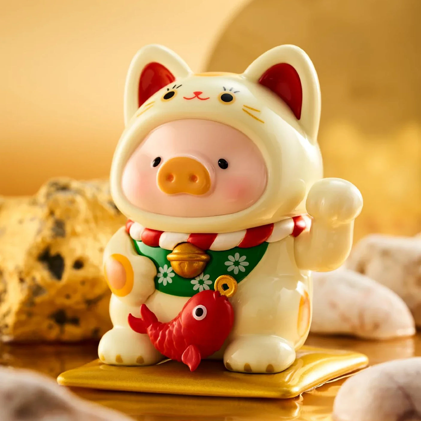 LuLu The Piggy - Lucky Cat Blind Box showing a piggy figurine in a white lucky cat costume holding a red fish by LuLu The Piggy