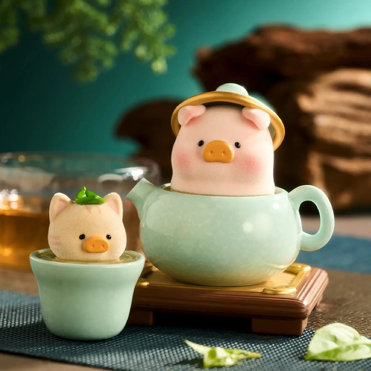 Pig chef toy figure as a teapot with a small bowl figure on a stand