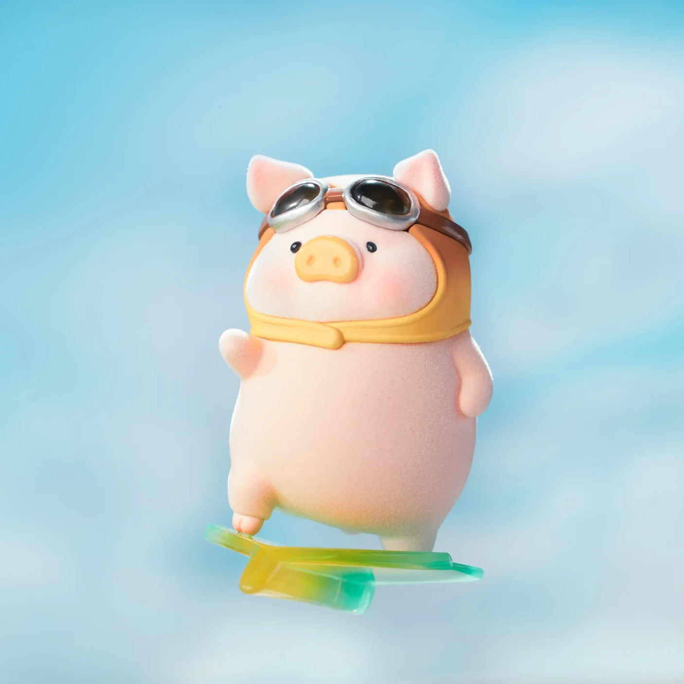 LuLu the Piggy figure wearing vintage pilot goggles and scarf riding a colorful surfboard against a blue sky background
