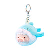 The LuLu The Piggy - Vibrating Shark Keychain features LuLu the Piggy in a blue shark costume. This adorable keychain by LuLu The Piggy adds a playful touch to your accessories.