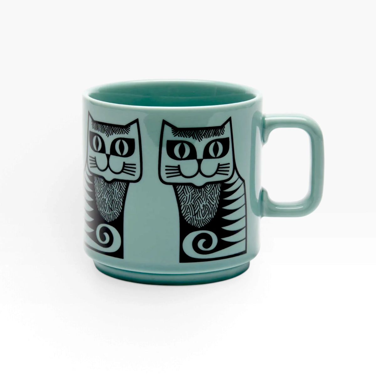 Teal ceramic mug with two black-and-gray cat faces and striped tails