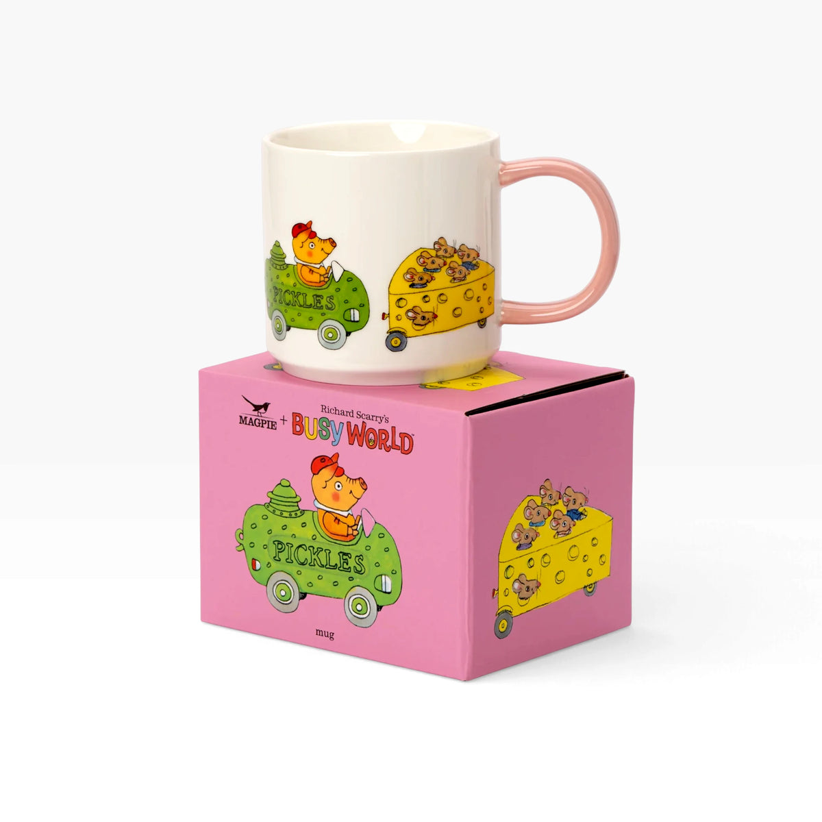 White ceramic mug with pink handle on pink box, busy world vehicle illustrations