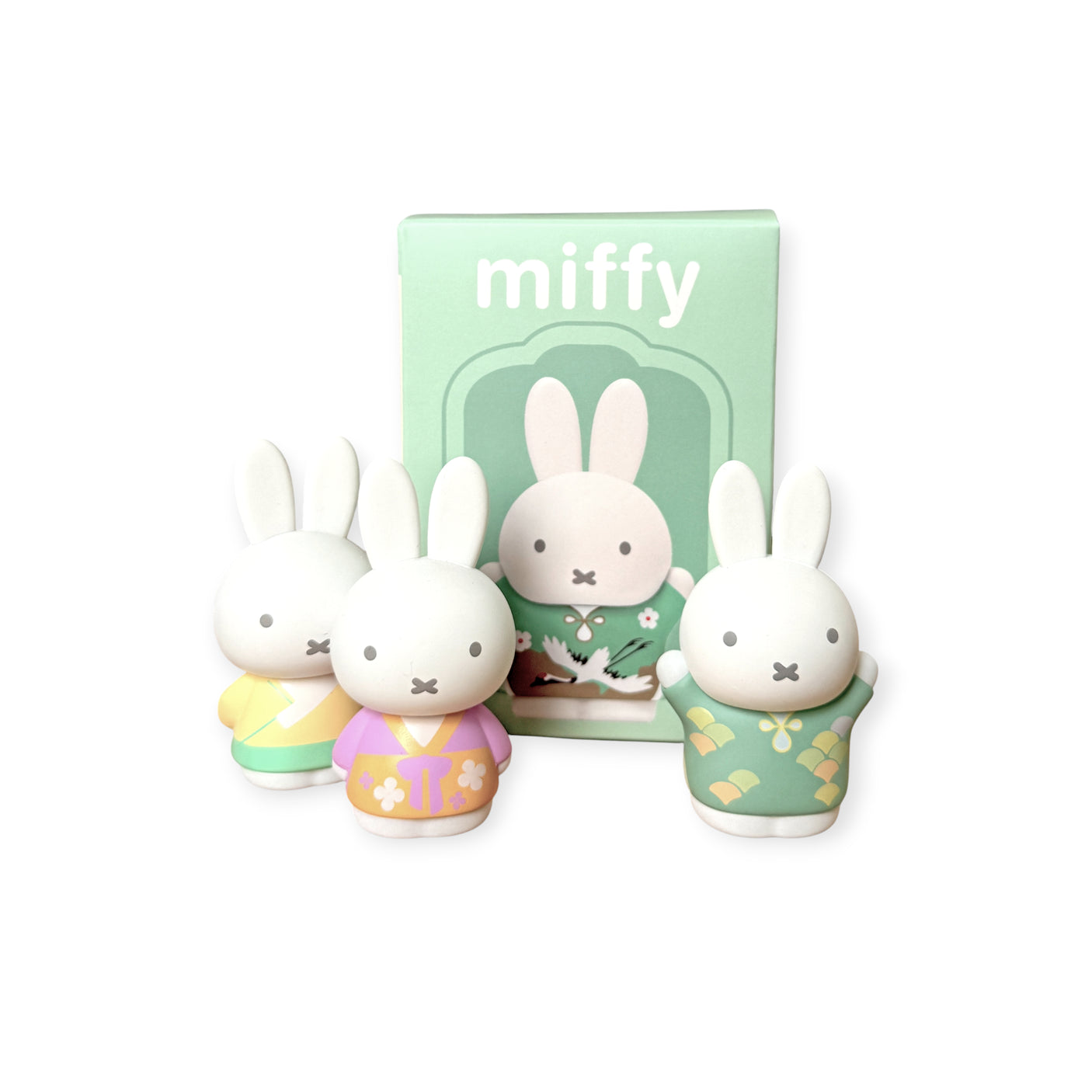 Three 6cm Miffy figures in pastel ancient-inspired costumes displayed in front of green-themed packaging box