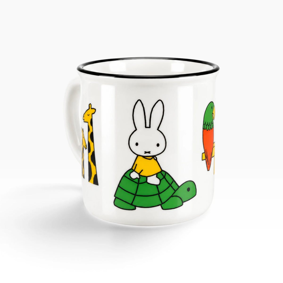 White ceramic mug with rabbit in a green sweater and parrot print, black rim