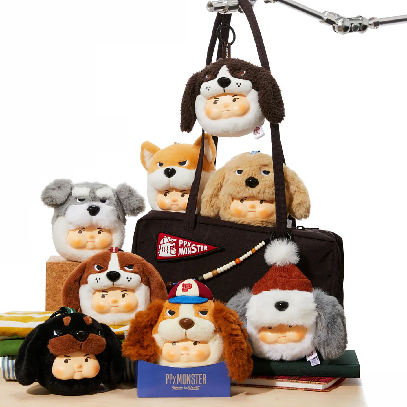 Hanging plush dog keychain assortment with multiple colors on a display stand