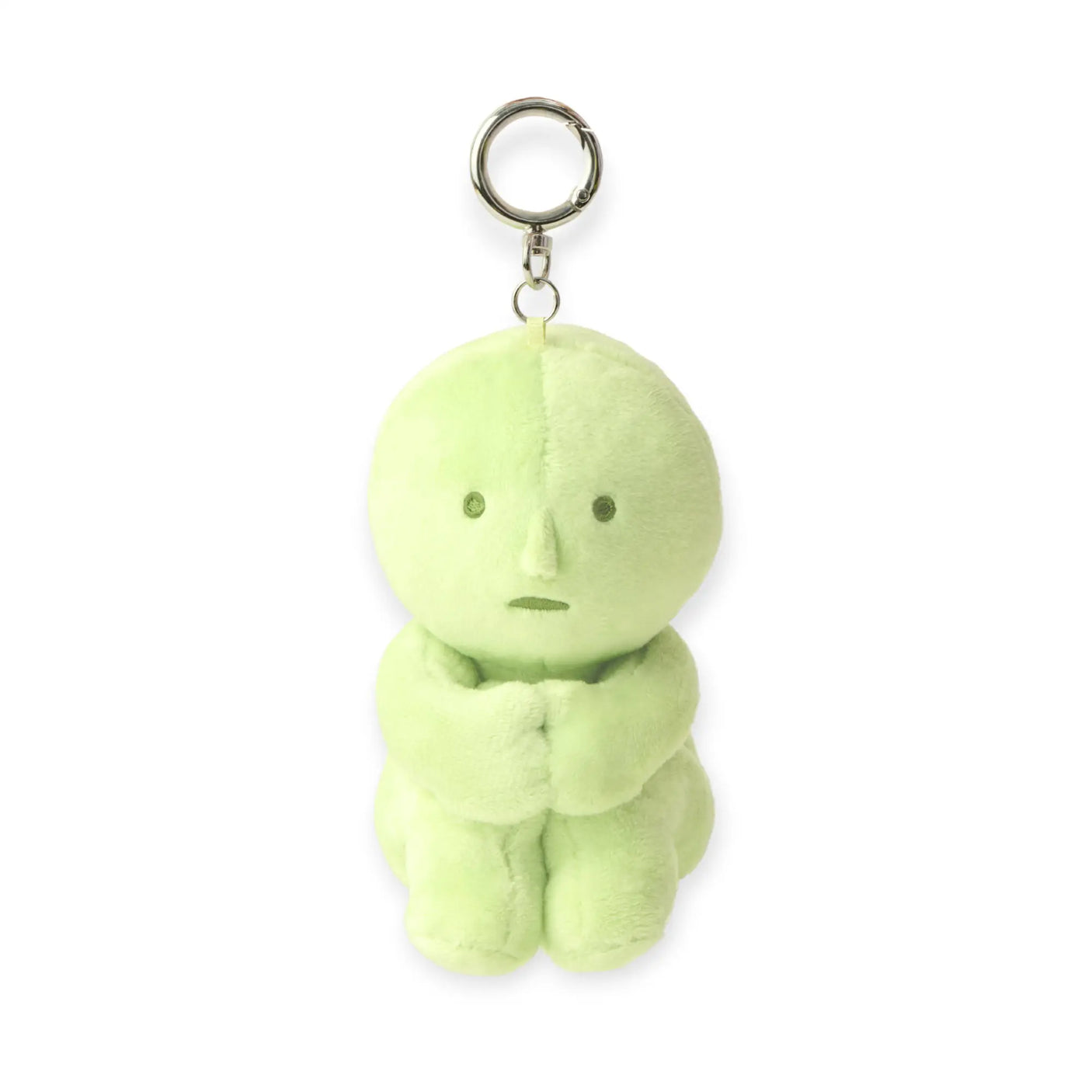 Green round plush keychain with metal key ring and small face details