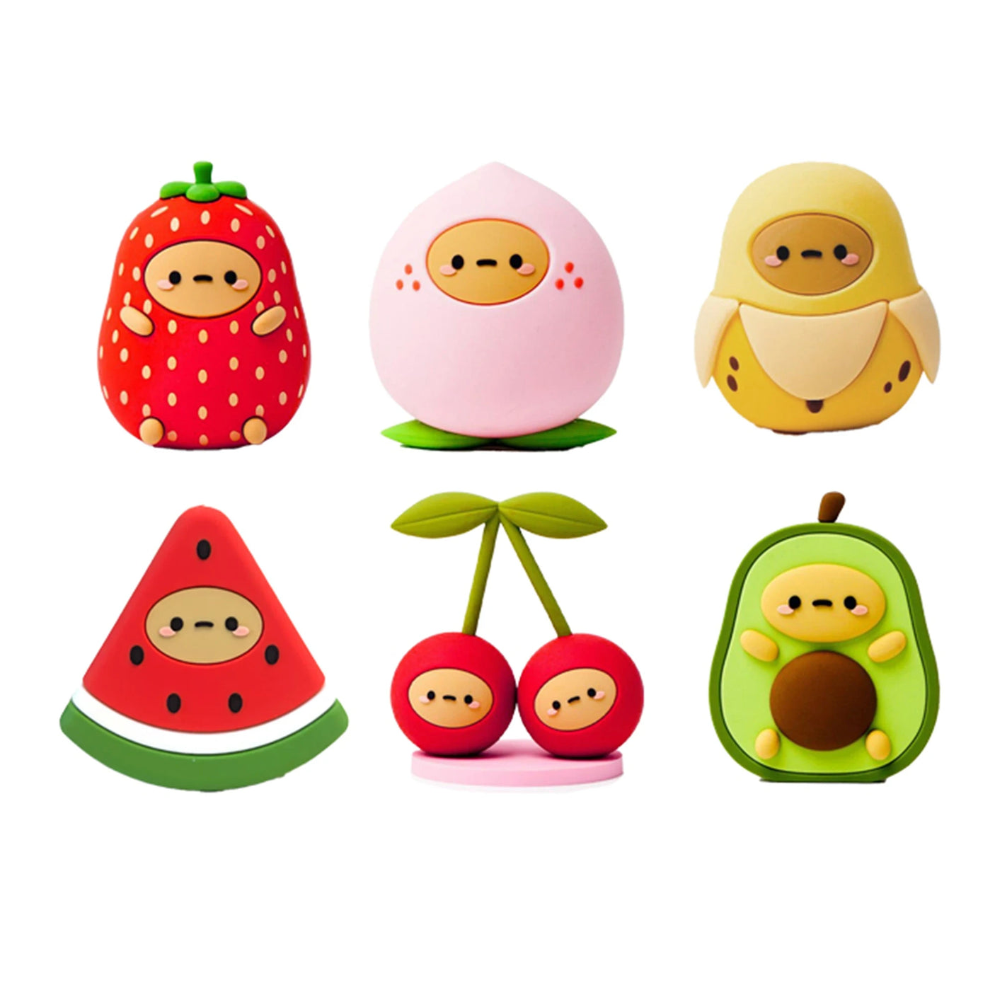 Six adorable cartoon characters with round faces in fruit costumes—strawberry, peach, banana, watermelon, cherries, and avocado—just like the Smoko Tayto Fruit Blind Box figures by Smoko, set against a white background.
