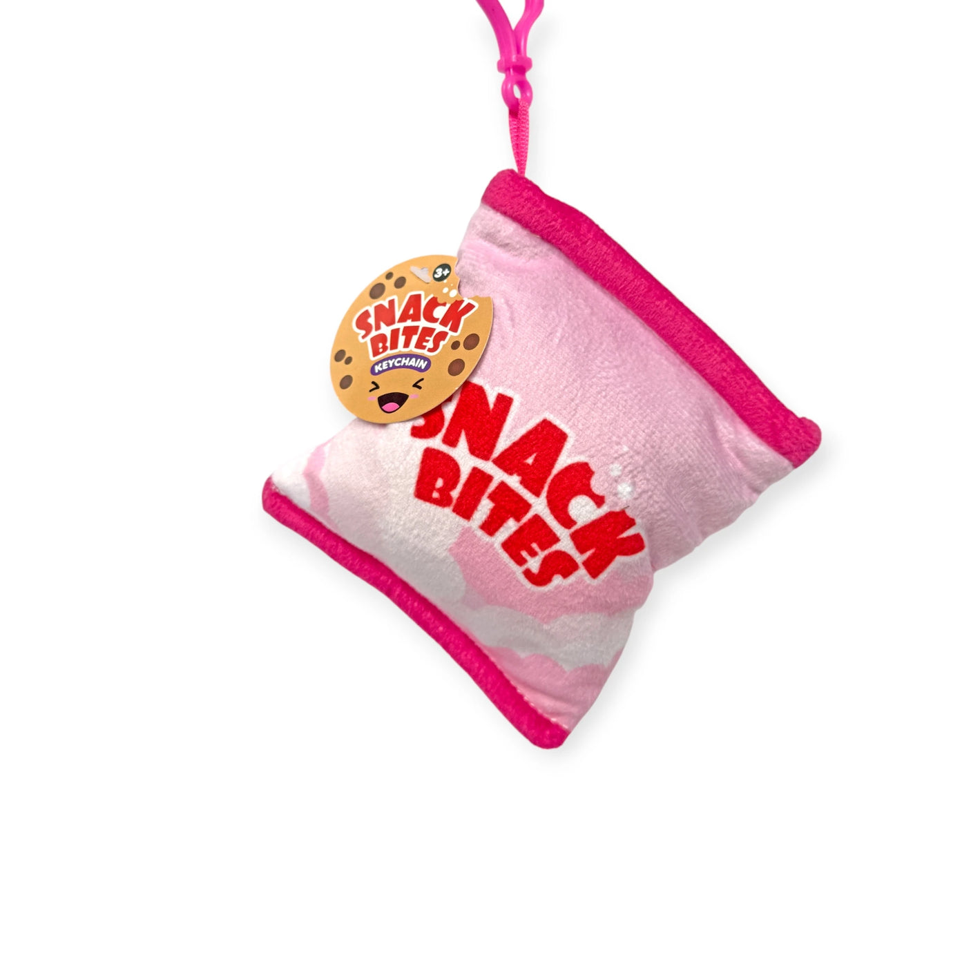 The Bensons "Snack Bites Bag Charm" is a plush pink dog toy in a playful snack bag shape, complete with red trim and a cookie-design tag, ideal for adding snack styles to playtime.