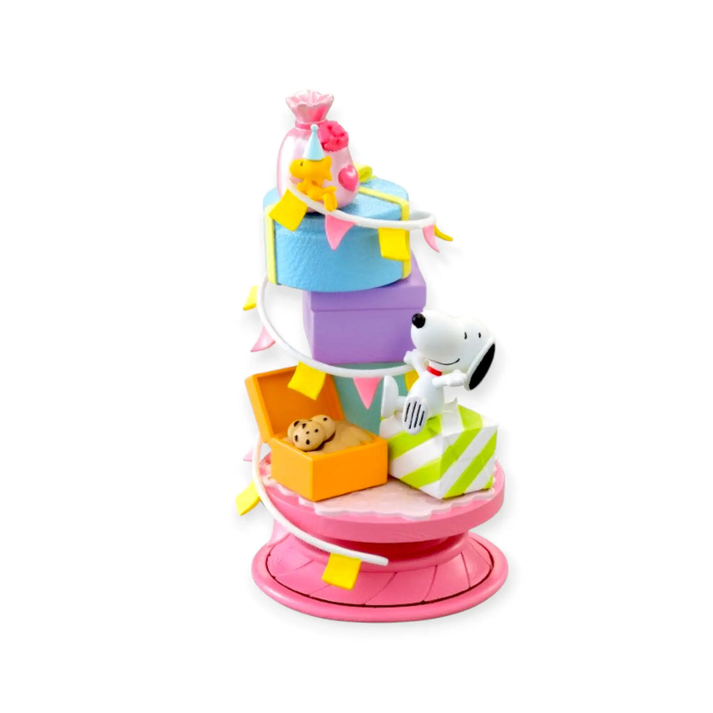 Snoopy spiral diorama figure on a pink base with colorful building blocks and dog character