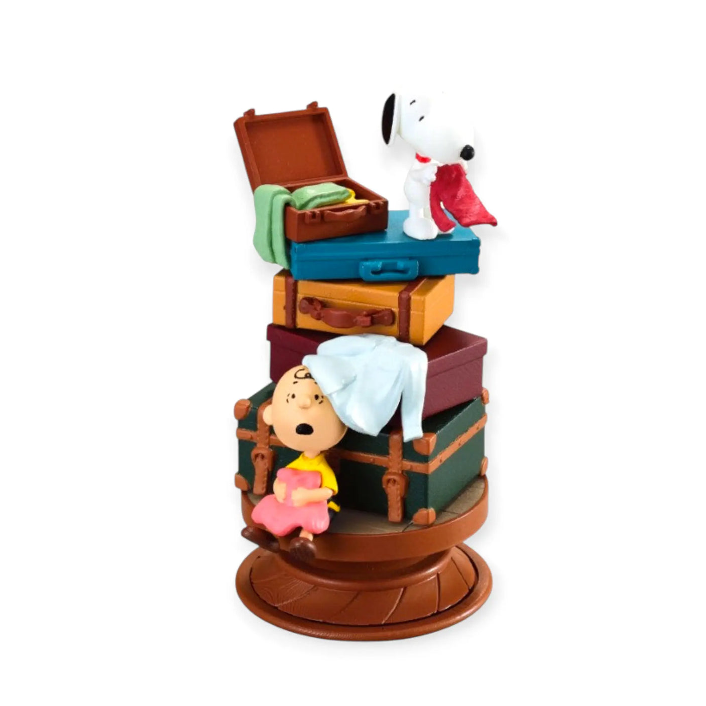 Snoopy spiral diorama figure on a brown base with open crate and Snoopy characters