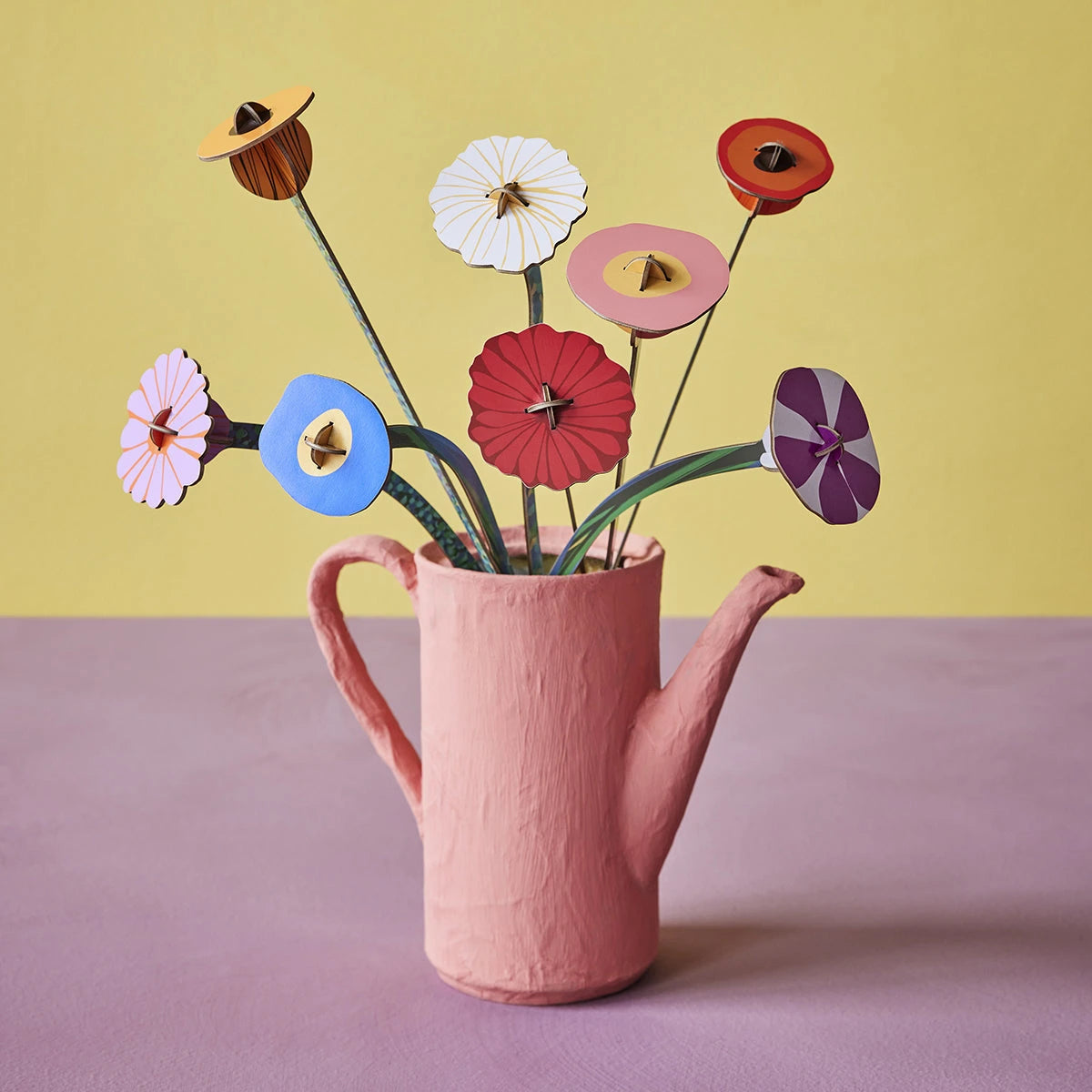 3D paper flower bouquet puzzle inspired by Klimt’s art arranged in textured pink pitcher on yellow and lavender background