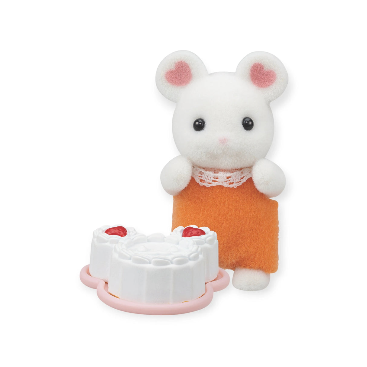 This adorable Sylvanian Families Baby Treats blind bag toy features a charming white mouse with heart-shaped ears in an orange dress, posed next to a detailed white cake with red decorations, capturing the brand's whimsical charm.