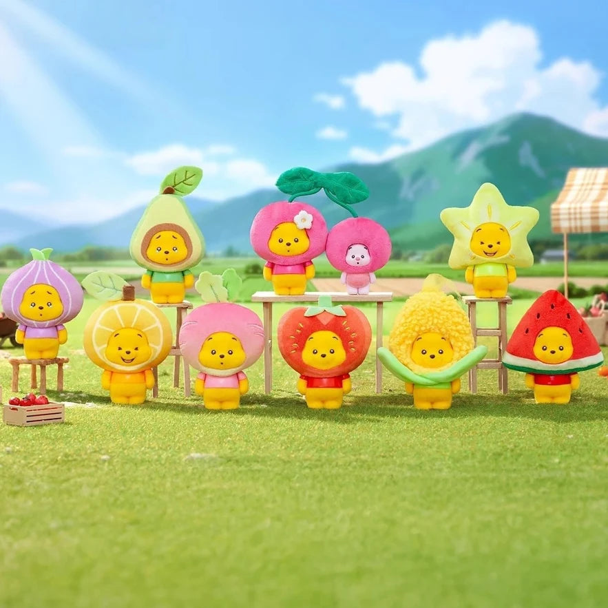 Set of colorful fruit plush keychains on display, each with a hanging loop