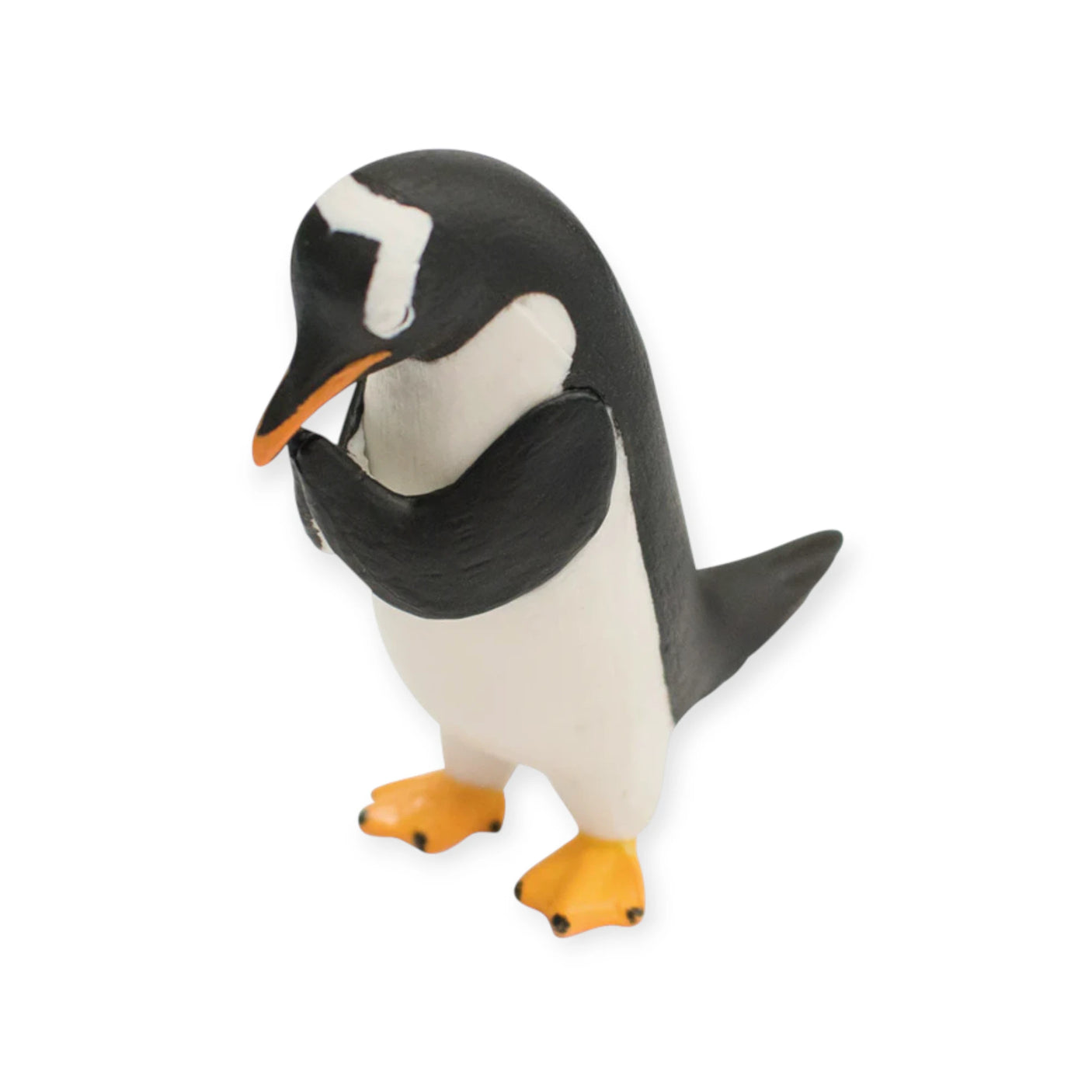 A small black and white plastic penguin with orange feet stands on a white background—one of the adorable collectible toys from Yell's Praying Animals Blind Box series.