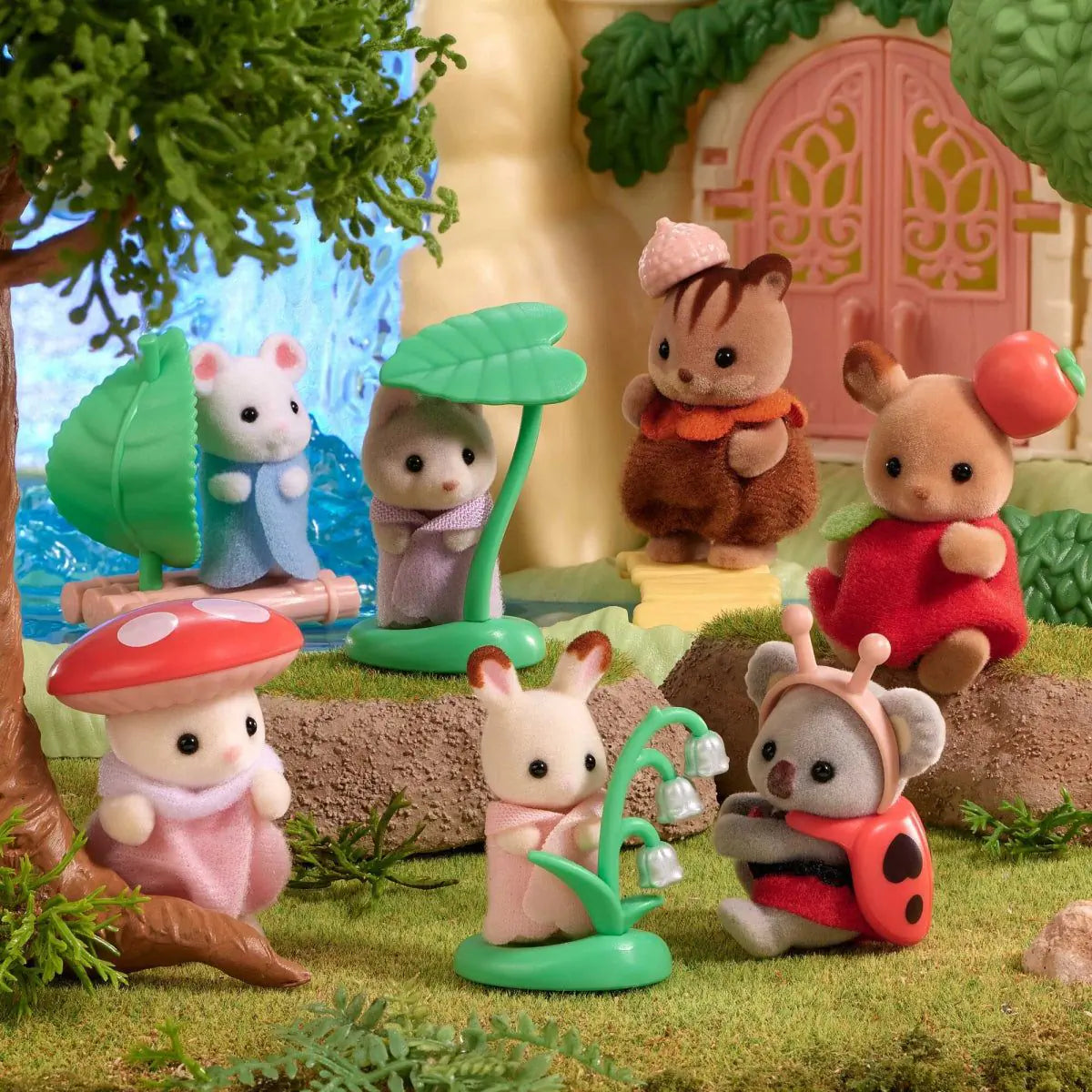 Sylvanian Families forest blind bag figures with small trees and a red apple