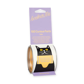 Another Me packaging featuring 100 daily curious cat facts with black cat illustration and lavender backdrop, gallery position 1