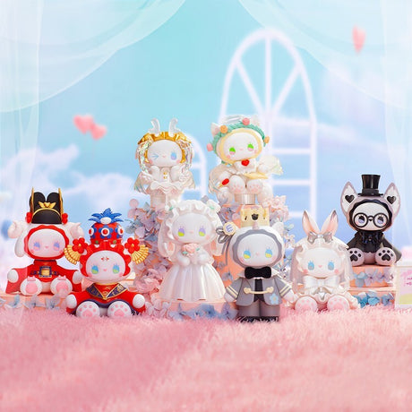 Nine pastel-colored, hand-painted Lucky EMMA Secret Forest Wedding figures by Lucky Emma, each with unique costumes and headpieces, are displayed on a pink fuzzy surface with a soft, dreamy background.