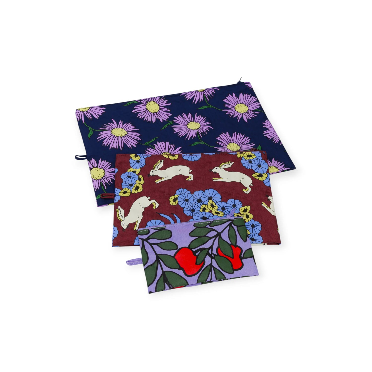 Set of three expandable Baggu Go pouches with playful floral and rabbit prints in Night Orchard colors