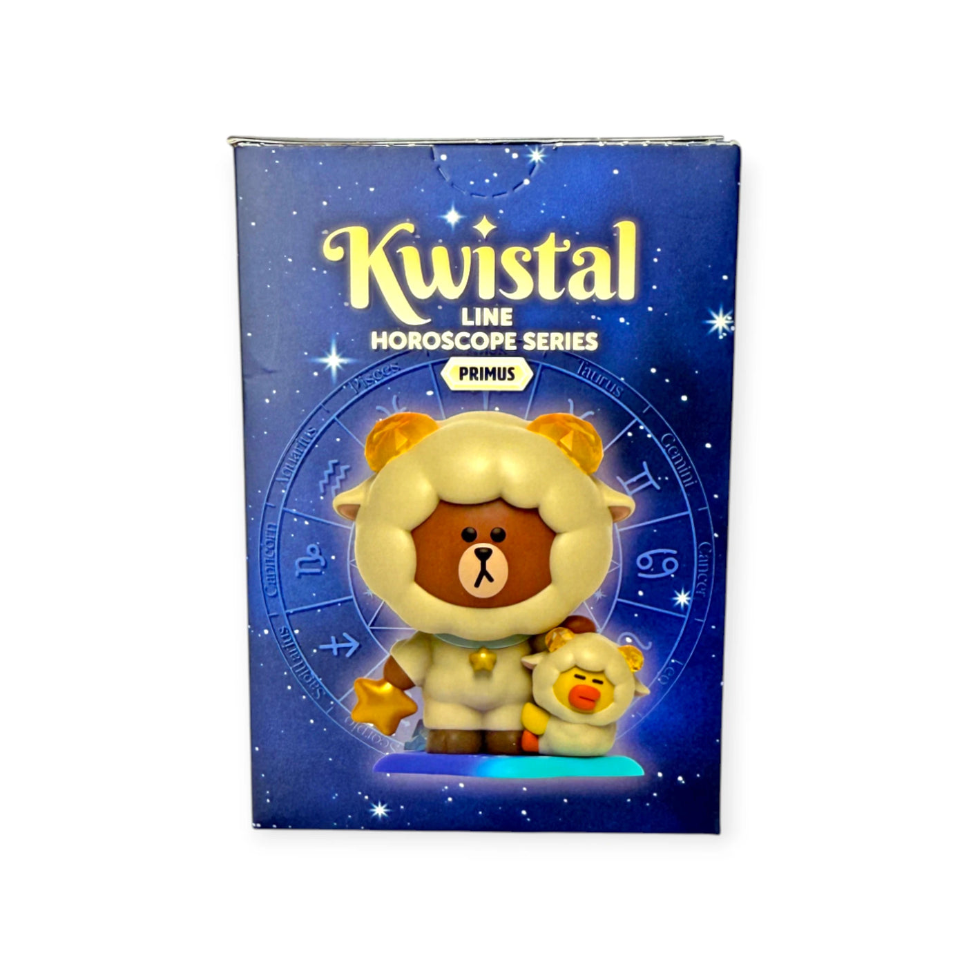 The Mighty Jaxx Kwistal Line Horoscope Primus Blind Box features a boxed figurine of a bear in a sheep costume with a small yellow chick, set against a zodiac-themed background.