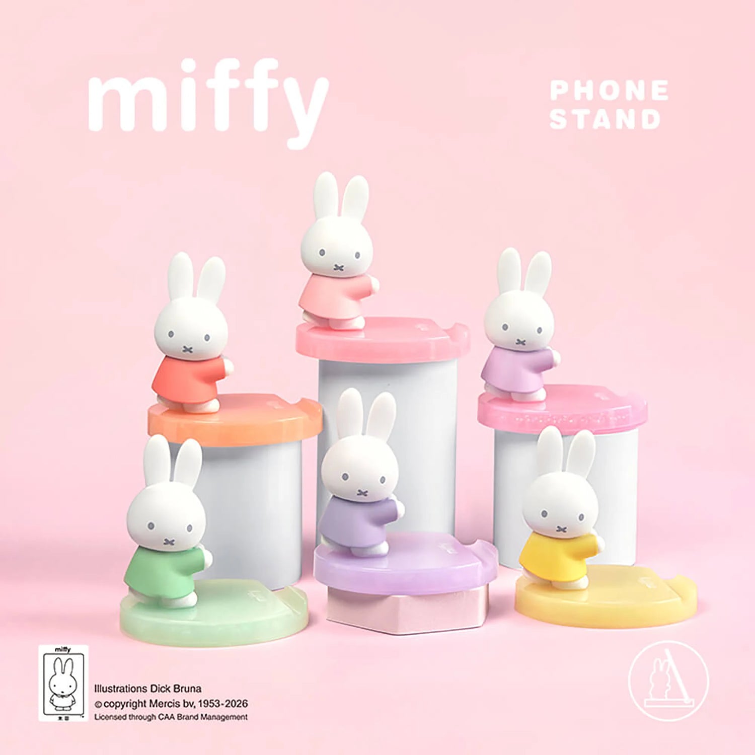 Assorted pastel bunny phone stands with white figurines on pink, orange, purple bases
