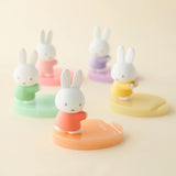 Assorted bunny phone stands with pastel bases in mint, teal, pink, orange, and yellow