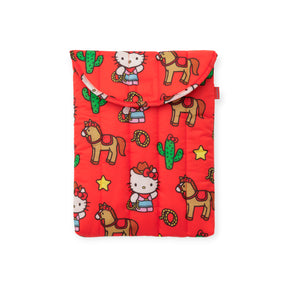 The Baggu Hello Kitty x Baggu Puffy Laptop 13"/14" - Western case features a red padded design with cartoon Hello Kitty in traditional dress, horses, cacti, stars, and lassos.