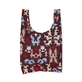 The Baggu Standard Baggu Bag - Western Cut Outs features maroon, blue, and beige abstract heart patterns on white, with wide handles and a rectangular base for comfortable carrying.