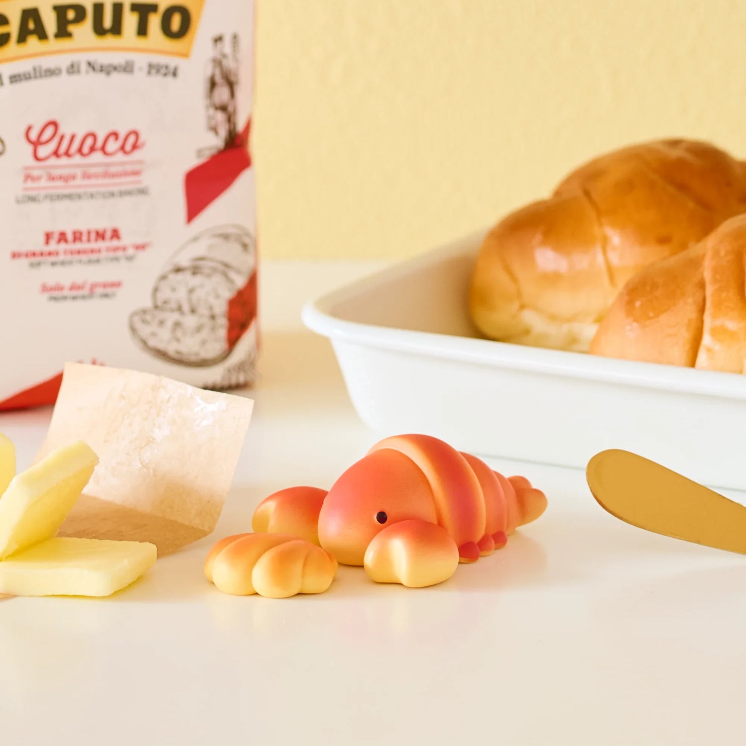 Animal Bakery Series 3 mini animal figure near bread roll and butter