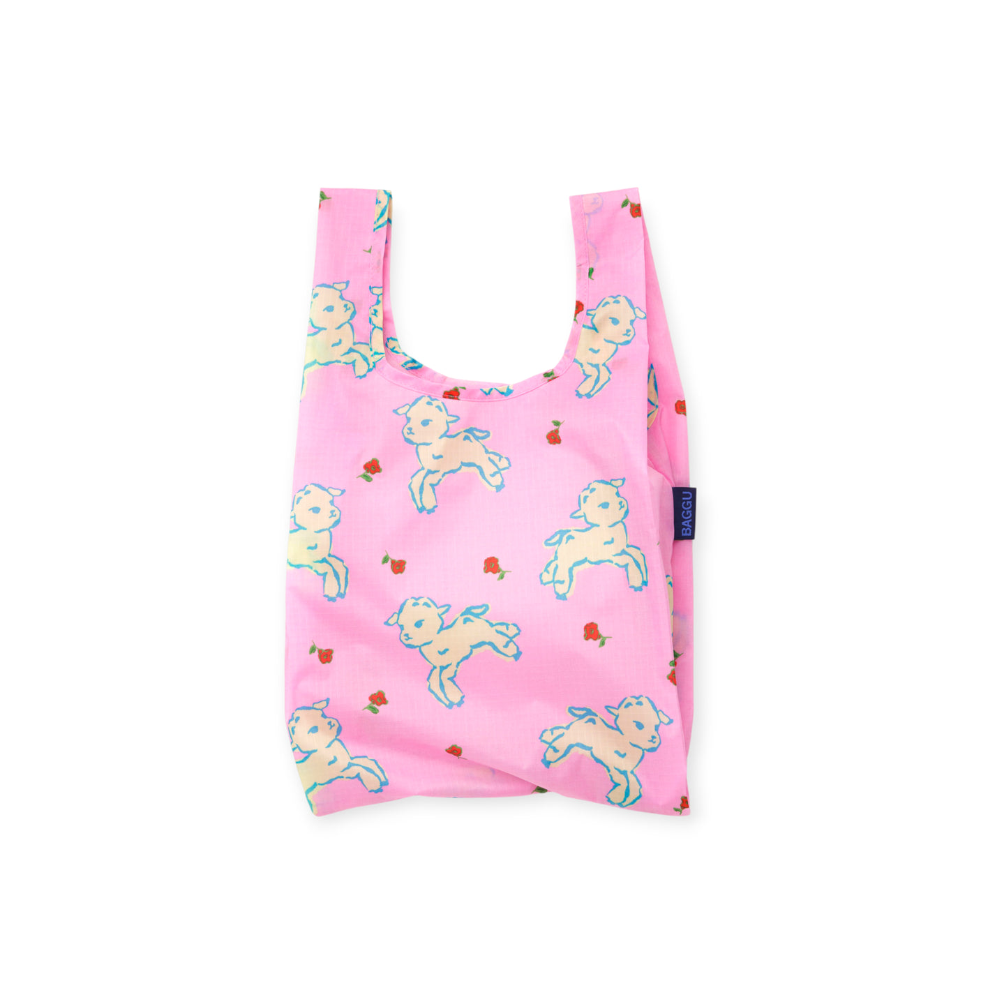 Pink reusable shopping bag with playful white lamb and small red flower pattern and fabric tag on side