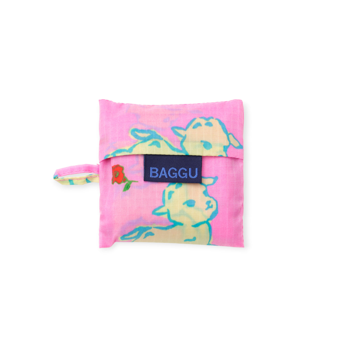 Folded pink fabric bag with cream lamb illustrations and blue outlines featuring a small rose on the side loop