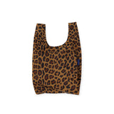 The Baggu Baby Baggu Leopard is a reusable shopping bag made from recycled nylon, featuring a simple handle and rectangular shape.