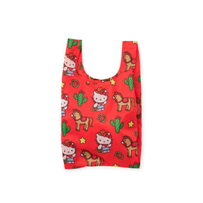 Red Baby Baggu reusable bag featuring Hello Kitty with cowboy hat, horses, cacti, and western-themed icons