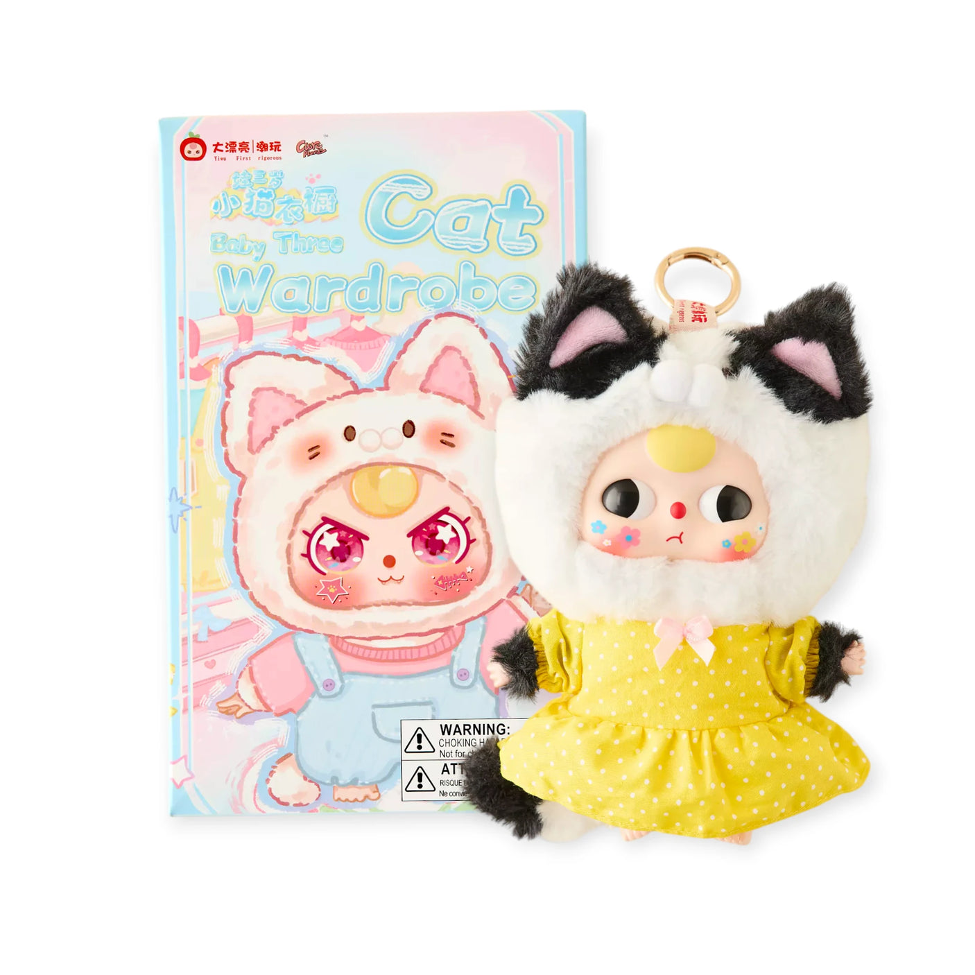 Cat keychain plush with white fur, black ear tufts, and yellow dress; gold key ring