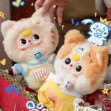 Two plush animal keychains with stitched faces in light blue and yellow outfits; key rings