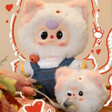 Two plush animal keychains: white cat in pink hoodie and small white mouse in denim; ring