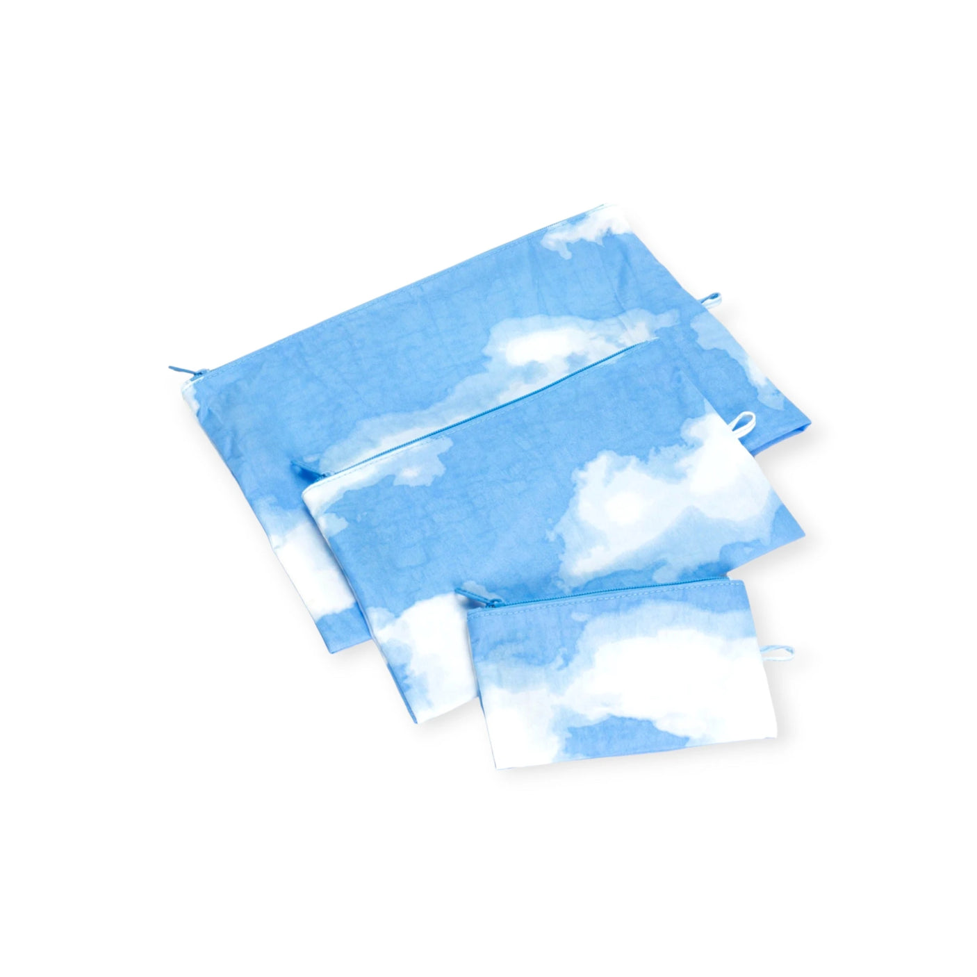 Three pouches from the Baggu Go Pouch Set - Clouds, in blue with a white cloud pattern, are neatly arranged on a white background—offering an organization dream with their practical and sustainable design.